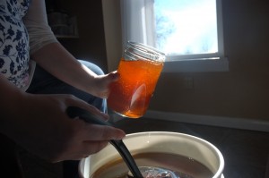 Baby and bottling the honey. 