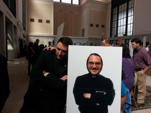 Joshua with the Vocation Director for the Diocese of Saint Augustine, trying on priesthood. (Joshua's company designed and sells that cut out.)  